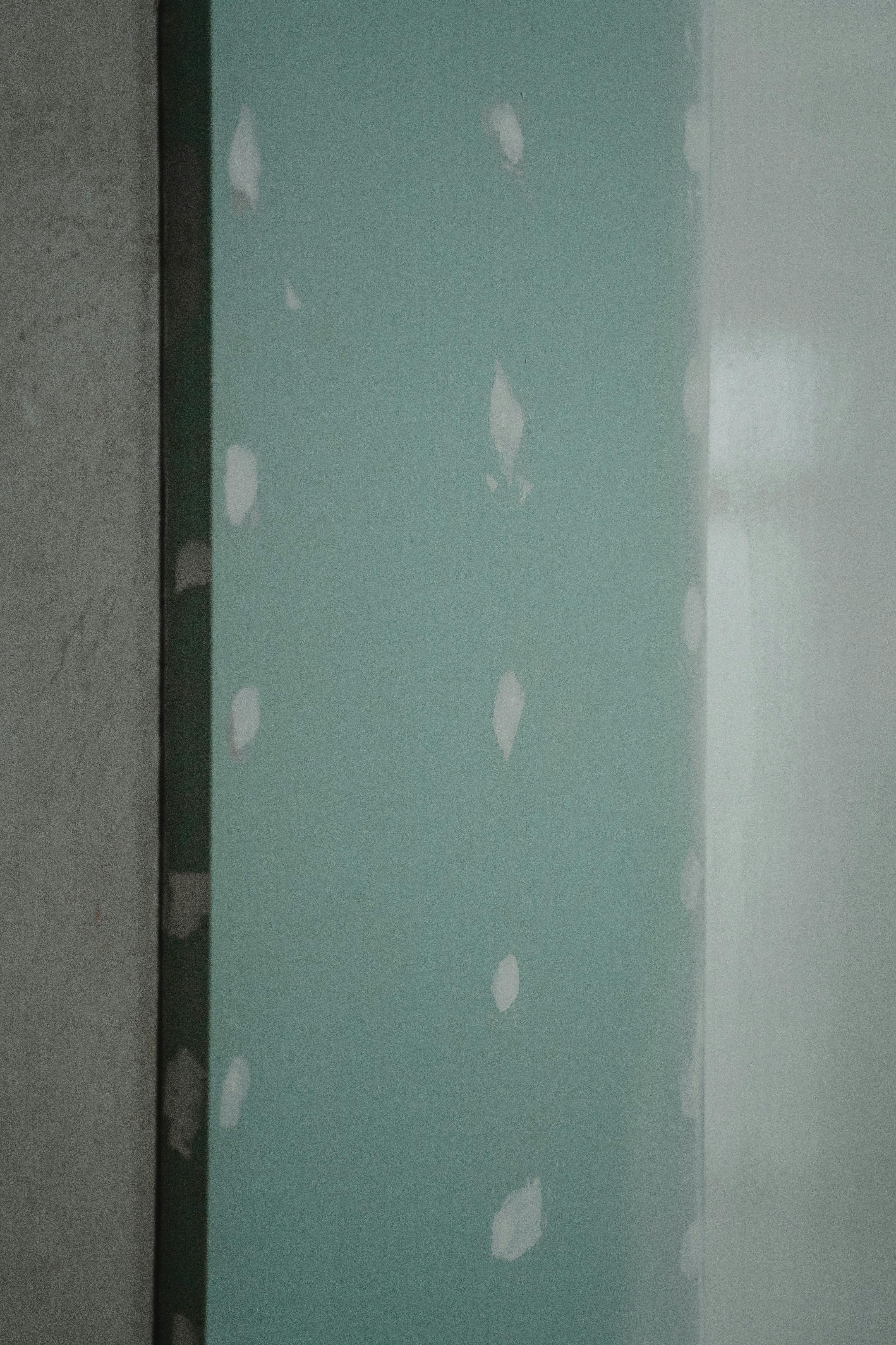 Moisture-resistant greenboard with fastener patching