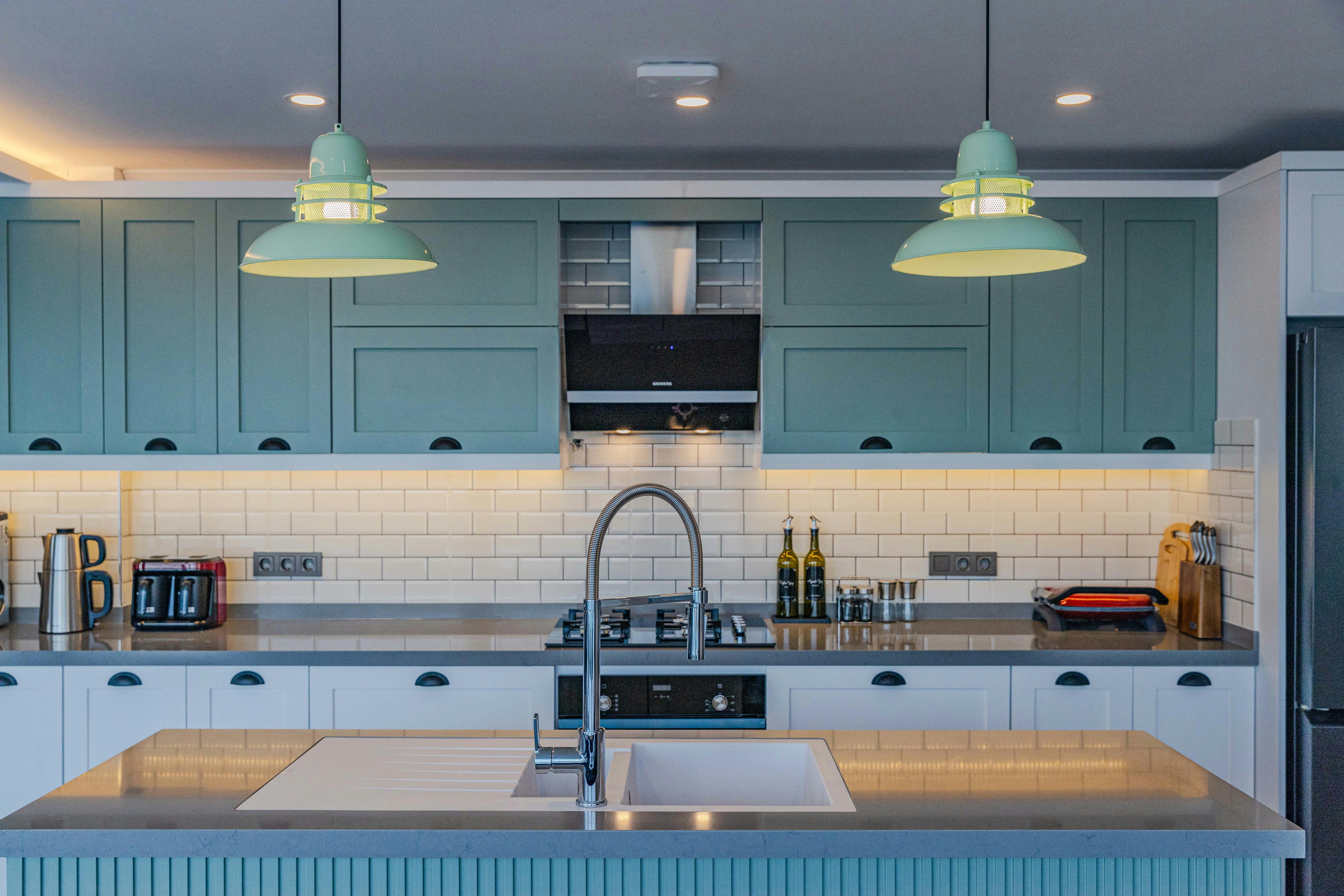 Kitchen with subway backsplash and pendant lights