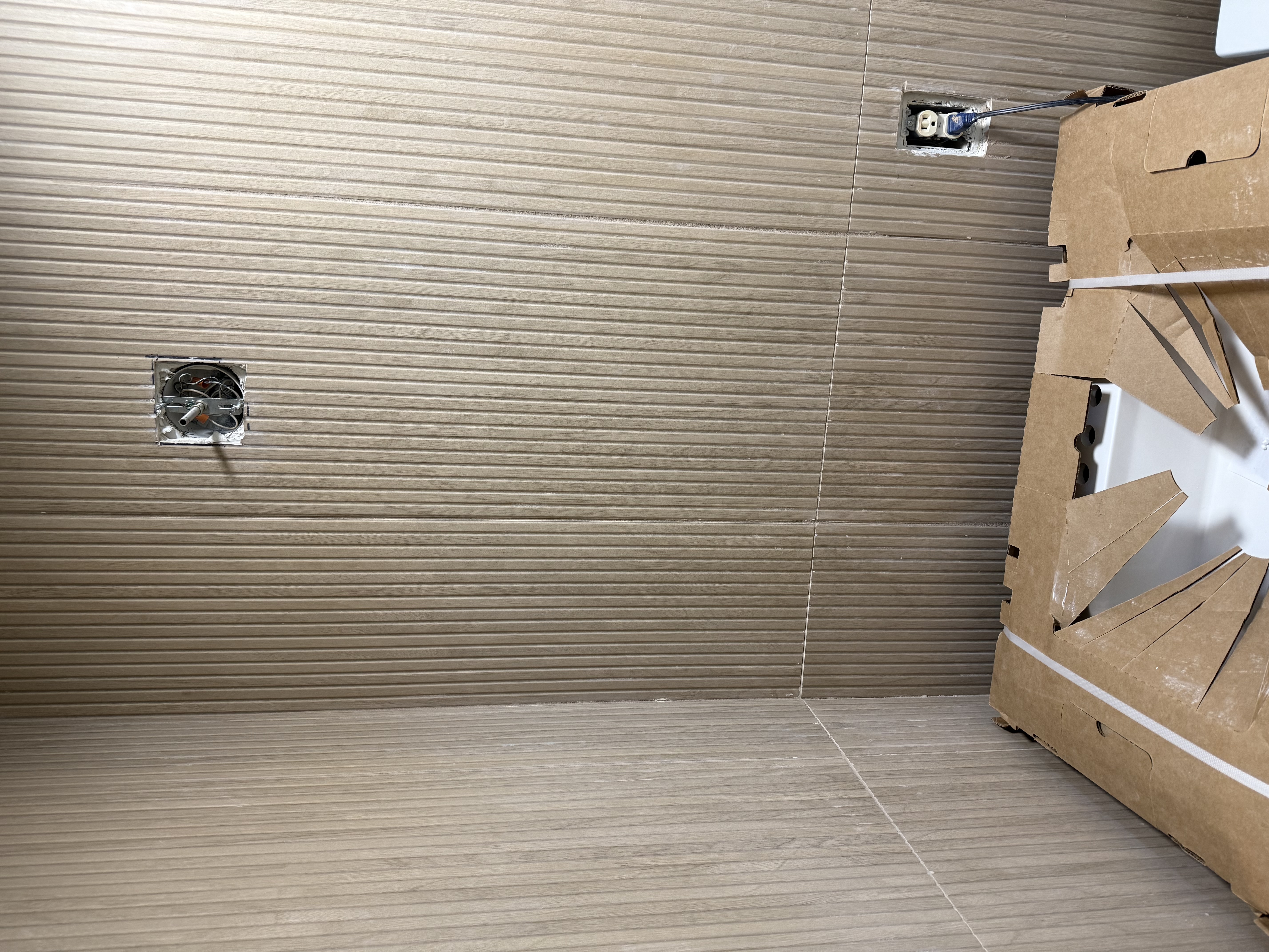 Bathroom wall tile detail before grout showing consistent joint spacing